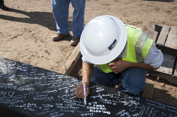 A worker signs the steel beam before it was lifted and placed at the top of the exhibit structure being built for space shuttle Atlantis. Image credit: NASA/Kim Shiflett A worker signs the steel beam before it was lifted and placed at the top of the exhibit structure being built for space shuttle Atlantis. Image credit: NASA/Kim Shiflett
