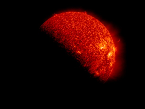 Still from video showing SDO's view of the sun being partially blocked by Earth. Credit: NASA/SDO