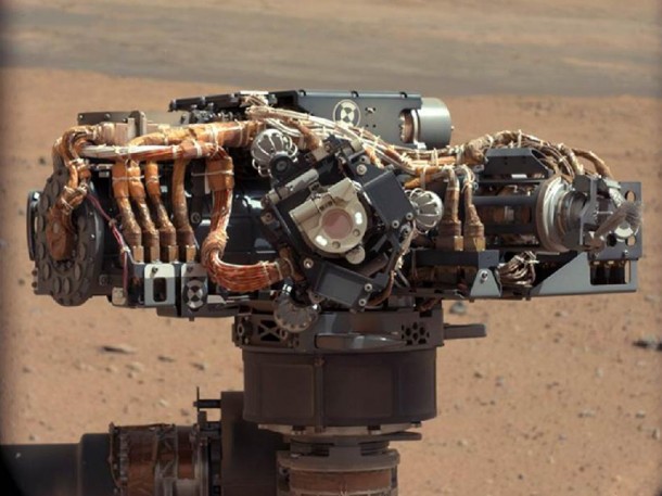 This image shows the Mars Hand Lens Imager (MAHLI) on NASA's Curiosity rover, with the Martian landscape in the background. Image credit: NASA/JPL-Caltech This image shows the Mars Hand Lens Imager (MAHLI) on NASA's Curiosity rover, with the Martian landscape in the background. Image credit: NASA/JPL-Caltech