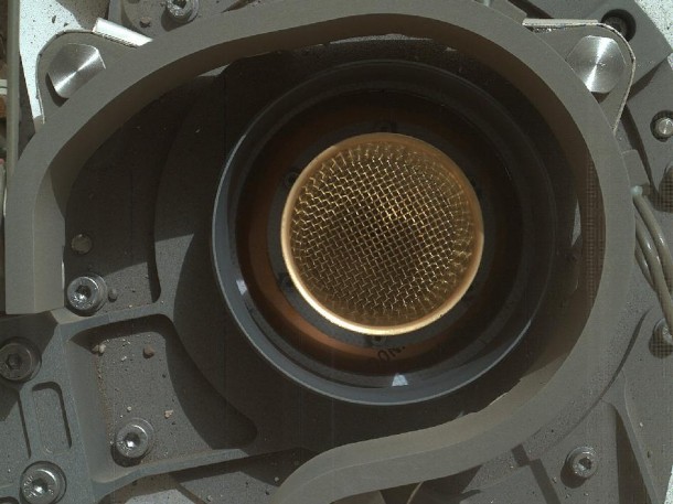 This image from NASA's Curiosity rover shows the open inlet where powered rock and soil samples will be funneled down for analysis. It was taken by the Mars Hand Lens Imager (MAHLI) on Curiosity's 36th Martian day, or sol, of operations on Mars (Sept. 11, 2012). MAHLI was about 8 inches (20 centimeters) away from the mouth of the Chemistry and Mineralogy (CheMin) instrument when it took the picture. The entrance of the funnel is about 1.4 inches (3.5 centimeters) in diameter. The mesh screen is about 2.3 inches (5.9 centimeters) deep. The mesh size is 0.04 inches (1 millimeter). Once the samples have gone down the funnel, CheMin will be shooting X-rays at the samples to identify and quantify the minerals. Image credit: NASA/JPL-Caltech/MSSS This image from NASA's Curiosity rover shows the open inlet where powered rock and soil samples will be funneled down for analysis. It was taken by the Mars Hand Lens Imager (MAHLI) on Curiosity's 36th Martian day, or sol, of operations on Mars (Sept. 11, 2012). MAHLI was about 8 inches (20 centimeters) away from the mouth of the Chemistry and Mineralogy (CheMin) instrument when it took the picture. The entrance of the funnel is about 1.4 inches (3.5 centimeters) in diameter. The mesh screen is about 2.3 inches (5.9 centimeters) deep. The mesh size is 0.04 inches (1 millimeter). Once the samples have gone down the funnel, CheMin will be shooting X-rays at the samples to identify and quantify the minerals. Image credit: NASA/JPL-Caltech/MSSS