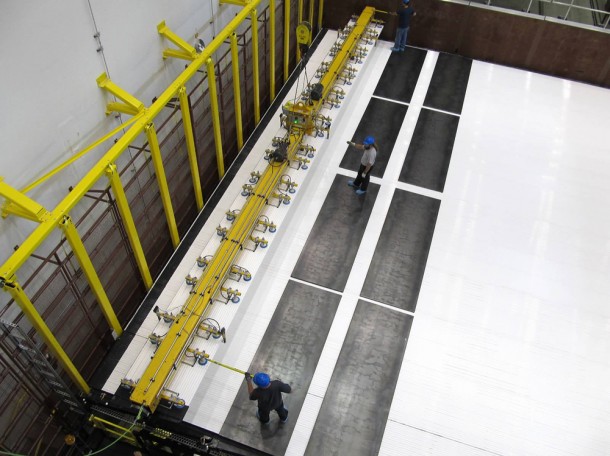 Technicians add modules to the first block of the NOvA detector. Photo by Ron Williams, NOvA lead foreman. Technicians add modules to the first block of the NOvA detector. Photo by Ron Williams, NOvA lead foreman.