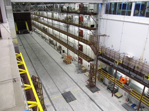 The 53-foot-tall pivoter machine, developed at Fermi National Accelerator Laboratory, will move the first block of the NOvA detector carefully down the 300-foot detector hall. Photo by Ron Williams, NOvA lead foreman. The 53-foot-tall pivoter machine, developed at Fermi National Accelerator Laboratory, will move the first block of the NOvA detector carefully down the 300-foot detector hall. Photo by Ron Williams, NOvA lead foreman.