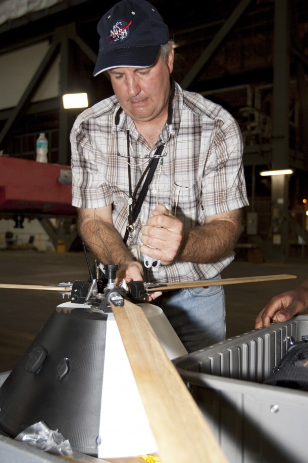 NASA's Johnson Space Center Aerospace Engineer Jeff Hagen attaches a rotor to the top of a model capsule ahead of drop tests inside the Vehicle Assembly Building at NASA's Kennedy Space Center in Florida. Photo credit: NASA/Kim Shiflett NASA's Johnson Space Center Aerospace Engineer Jeff Hagen attaches a rotor to the top of a model capsule ahead of drop tests inside the Vehicle Assembly Building at NASA's Kennedy Space Center in Florida. Photo credit: NASA/Kim Shiflett