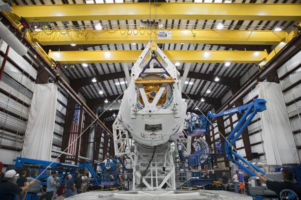 Technicians attach the Dragon capsule to a Falcon 9 rocket at the SpaceX facility at Cape Canaveral Air Force Station, Fla., during preparations for the CRS-1 mission. Photo credit: NASA/Kim Shiflett Technicians attach the Dragon capsule to a Falcon 9 rocket at the SpaceX facility at Cape Canaveral Air Force Station, Fla., during preparations for the CRS-1 mission. Photo credit: NASA/Kim Shiflett