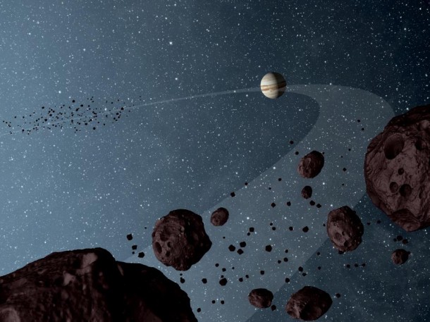New results from NASA's Wide-field Infrared Explorer, or WISE, reveal that the Jovian Trojans -- asteroids that lap the sun in the same orbit as Jupiter -- are uniformly dark with a hint of burgundy color, and have matte surfaces that reflect little sunlight. Image credit: NASA/JPL-Caltech New results from NASA's Wide-field Infrared Explorer, or WISE, reveal that the Jovian Trojans -- asteroids that lap the sun in the same orbit as Jupiter -- are uniformly dark with a hint of burgundy color, and have matte surfaces that reflect little sunlight. Image credit: NASA/JPL-Caltech