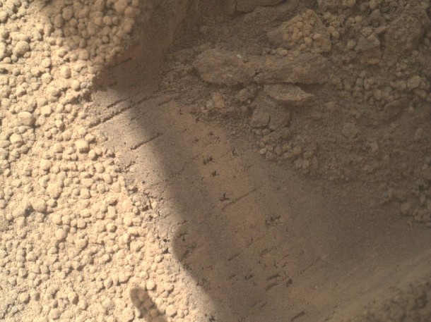 This image contributed to an interpretation by NASA's Mars rover Curiosity science team that some of the bright particles on the ground near the rover are native Martian material. Other light-toned material nearby has been assessed as small debris from the spacecraft. Image Credit: NASA/JPL-Caltech/MSSS This image contributed to an interpretation by NASA's Mars rover Curiosity science team that some of the bright particles on the ground near the rover are native Martian material. Other light-toned material nearby has been assessed as small debris from the spacecraft. Image Credit: NASA/JPL-Caltech/MSSS
