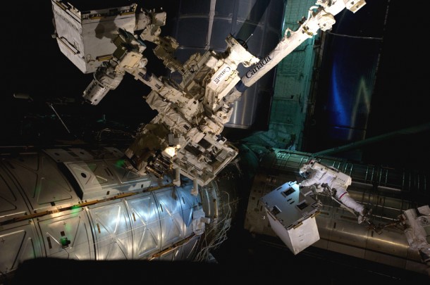 With his feet secured on a restraint on the space station remote manipulator system's robotic arm, NASA astronaut Mike Fossum holds the Robotics Refueling Mission payload. The four tools on the test device cut and manipulated wires, unscrewed caps, opened and closed valves and transferred fluid demonstrating that a remote-controlled robot can service and refuel a satellite. Photo credit: NASA With his feet secured on a restraint on the space station remote manipulator system's robotic arm, NASA astronaut Mike Fossum holds the Robotics Refueling Mission payload. The four tools on the test device cut and manipulated wires, unscrewed caps, opened and closed valves and transferred fluid demonstrating that a remote-controlled robot can service and refuel a satellite. Photo credit: NASA