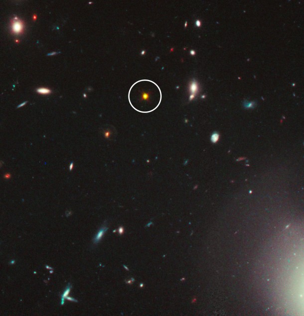 This is a Hubble Space Telescope view of one of the most distant and luminous quasars ever seen (circled in white) and dates to less than one billion years after the big bang. This near-infrared light image was taken with Hubble's Wide Field Camera 3 in December 2010 and January 2011. (Credit: NASA/ESA/M. Mechtley, R. Windhorst, Arizona State University) This is a Hubble Space Telescope view of one of the most distant and luminous quasars ever seen (circled in white) and dates to less than one billion years after the big bang. This near-infrared light image was taken with Hubble's Wide Field Camera 3 in December 2010 and January 2011. (Credit: NASA/ESA/M. Mechtley, R. Windhorst, Arizona State University)