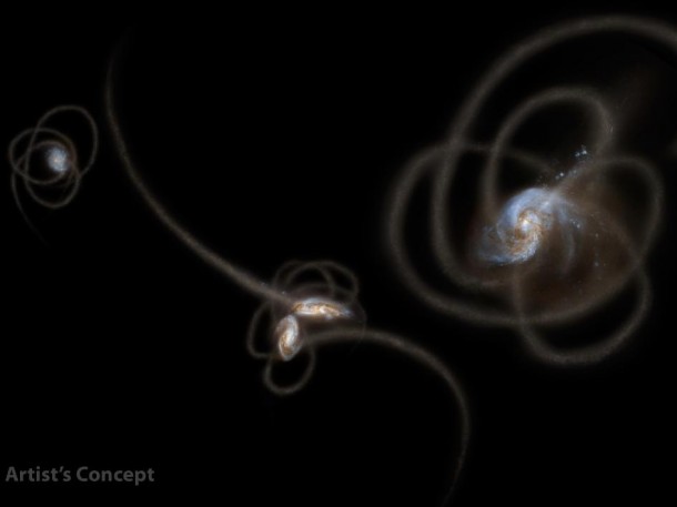 New research from scientists using NASA's Spitzer Space Telescope suggests that a mysterious infrared glow across our whole sky is coming from stray stars torn from galaxies. When galaxies grow, they merge and become gravitationally tangled in a violent process that results in streams of stars being ripped away from the galaxies. Such streams, called tidal tails, can be seen in this artist's concept. Scientists say that Spitzer is picking up the collective glow of stars such as these, which linger in the spaces between galaxies. Image credit: NASA/JPL-Caltech/UC Irvine New research from scientists using NASA's Spitzer Space Telescope suggests that a mysterious infrared glow across our whole sky is coming from stray stars torn from galaxies. When galaxies grow, they merge and become gravitationally tangled in a violent process that results in streams of stars being ripped away from the galaxies. Such streams, called tidal tails, can be seen in this artist's concept. Scientists say that Spitzer is picking up the collective glow of stars such as these, which linger in the spaces between galaxies. Image credit: NASA/JPL-Caltech/UC Irvine