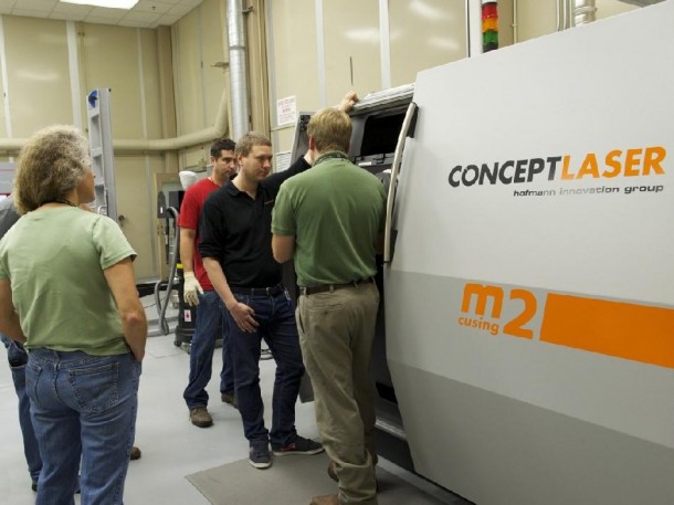 Engineers at Marshall Space Flight Center observe the new Selective Laser Melting machine. (NASA/MSFC/Andy Hardin) Engineers at Marshall Space Flight Center observe the new Selective Laser Melting machine. (NASA/MSFC/Andy Hardin)