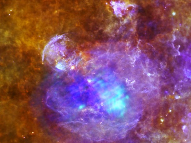 Supernova remnant W44 is the focus of this new image created by combining data from ESA's Herschel and XMM-Newton space observatories. W44 is the vast purple sphere that dominates the left hand side of this image, and measures about 100 light-years across. Image credits: Herschel: Quang Nguyen Luong & F. Motte, HOBYS Key Program consortium, Herschel SPIRE/PACS/ESA consortia. XMM-Newton: ESA/XMM-Newton Supernova remnant W44 is the focus of this new image created by combining data from ESA's Herschel and XMM-Newton space observatories. W44 is the vast purple sphere that dominates the left hand side of this image, and measures about 100 light-years across. Image credits: Herschel: Quang Nguyen Luong & F. Motte, HOBYS Key Program consortium, Herschel SPIRE/PACS/ESA consortia. XMM-Newton: ESA/XMM-Newton