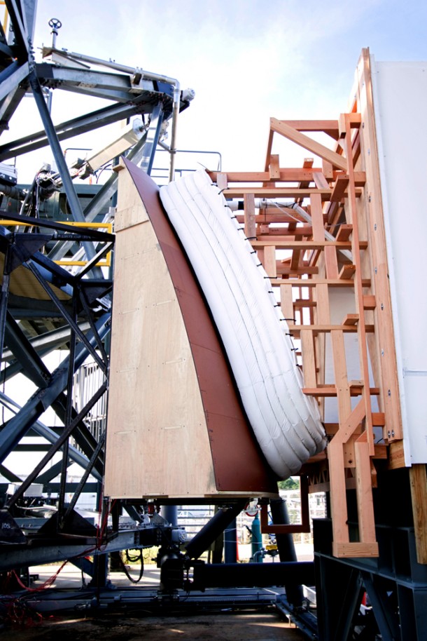 The Orion spacecraft crew access arm seal prototype is being checked out at the Launch Equipment Test Facility at NASA's Kennedy Space Center in Florida. The tests include a mockup of the vehicle outer mold line and the White Room that would be at the end of the access arm. Testing simulated work going on in the White Room while attached to the Orion. Photo credit: NASA/Jim Grossmann The Orion spacecraft crew access arm seal prototype is being checked out at the Launch Equipment Test Facility at NASA's Kennedy Space Center in Florida. The tests include a mockup of the vehicle outer mold line and the White Room that would be at the end of the access arm. Testing simulated work going on in the White Room while attached to the Orion. Photo credit: NASA/Jim Grossmann