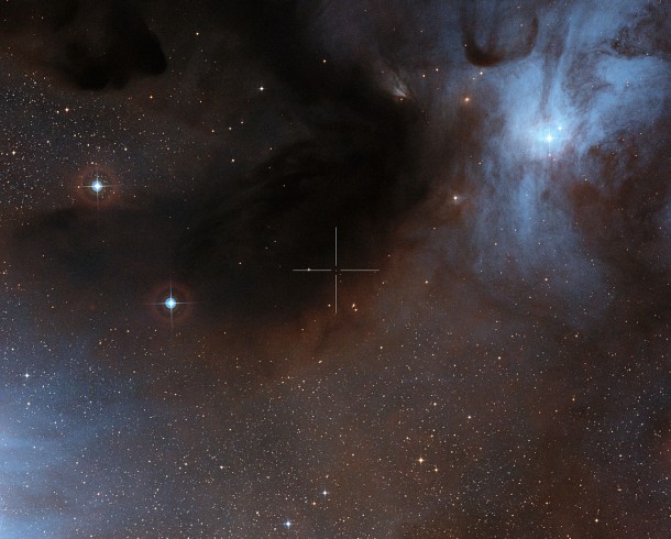 This image shows the brown dwarf ISO-Oph 102, or Rho-Oph 102, in the Rho Ophiuchi star-forming region. Its position is marked by the crosshairs. This visible-light view was created from images forming part of the Digitized Sky Survey 2. Credit: ALMA (ESO/NAOJ/NRAO)/Digitized Sky Survey 2. Acknowledgement: Davide De Martin This image shows the brown dwarf ISO-Oph 102, or Rho-Oph 102, in the Rho Ophiuchi star-forming region. Its position is marked by the crosshairs. This visible-light view was created from images forming part of the Digitized Sky Survey 2. Credit: ALMA (ESO/NAOJ/NRAO)/Digitized Sky Survey 2. Acknowledgement: Davide De Martin