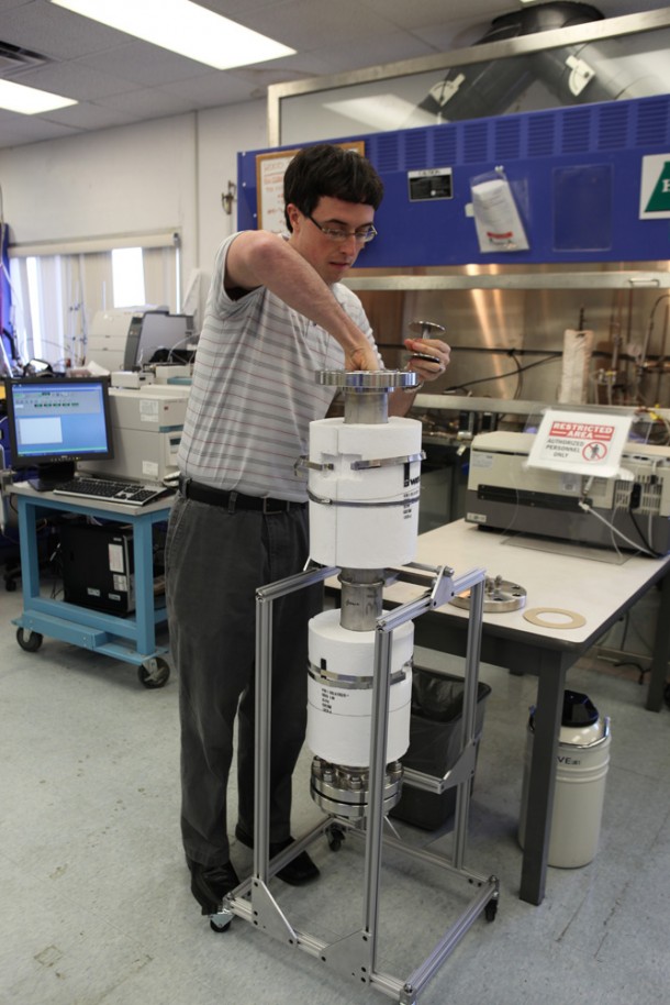 Stephen Anthony works with the new reactor prototype researchers are using to incinerate trash. Image credit: NASA/Dmitri Gerondidakis Stephen Anthony works with the new reactor prototype researchers are using to incinerate trash. Image credit: NASA/Dmitri Gerondidakis