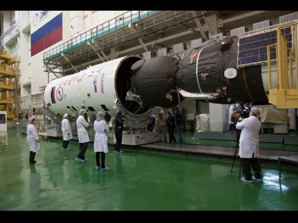 In the Integration Facility at the Baikonur Cosmodrome in Kazakhstan, the Soyuz TMA-07M spacecraft is encapsulated into the upper stage of the Soyuz booster Credit: NASA/Victor Zelentsov In the Integration Facility at the Baikonur Cosmodrome in Kazakhstan, the Soyuz TMA-07M spacecraft is encapsulated into the upper stage of the Soyuz booster Credit: NASA/Victor Zelentsov