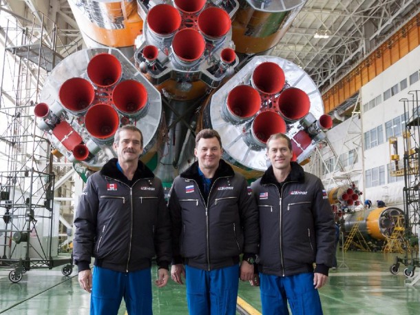 Flight Engineers Chris Hadfield, Roman Romanenko and Tom Marshburn pose for pictures in front of the cluster of first stage Soyuz booster engines. Credit: NASA/Victor Zelentsov Flight Engineers Chris Hadfield, Roman Romanenko and Tom Marshburn pose for pictures in front of the cluster of first stage Soyuz booster engines. Credit: NASA/Victor Zelentsov