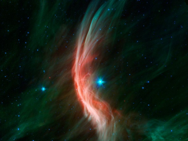 The giant star Zeta Ophiuchi is having a "shocking" effect on the surrounding dust clouds in this infrared image from NASA’s Spitzer Space Telescope. Image credit: NASA/JPL-Caltech The giant star Zeta Ophiuchi is having a "shocking" effect on the surrounding dust clouds in this infrared image from NASA’s Spitzer Space Telescope. Image credit: NASA/JPL-Caltech