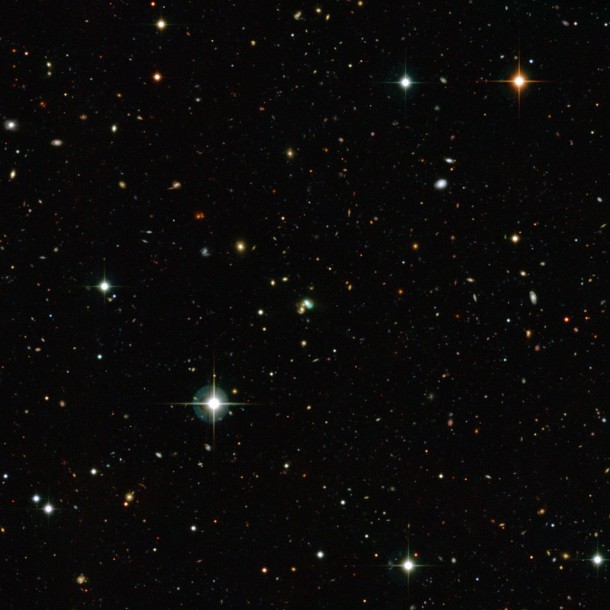 This view from the Canada-France-Hawaii Telescope shows thousands of galaxies in the distant Universe. But the one close to the centre looks very odd — it is bright green. This very unusual object is known as J224024.1−092748. Credit: CFHT/ESO/M. Schirmer This view from the Canada-France-Hawaii Telescope shows thousands of galaxies in the distant Universe. But the one close to the centre looks very odd — it is bright green. This very unusual object is known as J224024.1−092748. Credit: CFHT/ESO/M. Schirmer