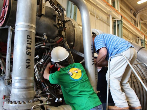 Propulsion engineers refurbish an F-1 engine. (NASA/MSFC) 