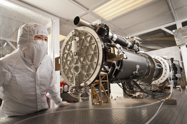 Lockheed Martin Space Systems engineer Cathy Chou, integration and test lead for NASA's Interface Region Imaging Spectrograph (IRIS) observatory, inspects the IRIS solar telescope in a clean room at the company's Advanced Technology Center in Palo Alto, Calif. Credit: Lockheed Martin Lockheed Martin Space Systems engineer Cathy Chou, integration and test lead for NASA's Interface Region Imaging Spectrograph (IRIS) observatory, inspects the IRIS solar telescope in a clean room at the company's Advanced Technology Center in Palo Alto, Calif. Credit: Lockheed Martin