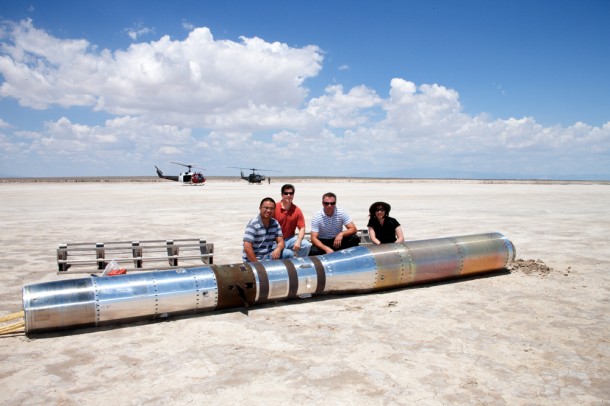 The recovering team poses for a photo with the payload before loading the instrument in a pair of U.S. Army Helicopters and returning to base. (NASA/MSFC) The recovering team poses for a photo with the payload before loading the instrument in a pair of U.S. Army Helicopters and returning to base. (NASA/MSFC)