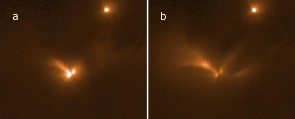 Hubble Space Telescope 1.6 micron images taken at two epochs corresponding to pulse phases of 0 (a) and 0.3 (b). North is up and east is to the left. LRLL 54361 is the extended source to the lower left; the point source at upper right is another young star, LRLL 1843. The light from LRLL 54361 subtends roughly 14” (~4000 AU at the distance of the IC 348 region) in (a), and about 50” (~15,000 AU) in (b). Most if not all of this light is likely the result of scattering of circumstellar dust in the protostellar envelope. An apparent edge-on disk is visible in the center, and 3 separate structures indicative of outflow cavities extend to the northwest, southwest, and northeast. The extent and morphology of the scattered light changes substantially between epochs as a result of the propagation of the pulse peak light. Photo courtesy of Robert Gutermuth Hubble Space Telescope 1.6 micron images taken at two epochs corresponding to pulse phases of 0 (a) and 0.3 (b). North is up and east is to the left. LRLL 54361 is the extended source to the lower left; the point source at upper right is another young star, LRLL 1843. The light from LRLL 54361 subtends roughly 14” (~4000 AU at the distance of the IC 348 region) in (a), and about 50” (~15,000 AU) in (b). Most if not all of this light is likely the result of scattering of circumstellar dust in the protostellar envelope. An apparent edge-on disk is visible in the center, and 3 separate structures indicative of outflow cavities extend to the northwest, southwest, and northeast. The extent and morphology of the scattered light changes substantially between epochs as a result of the propagation of the pulse peak light. Photo courtesy of Robert Gutermuth