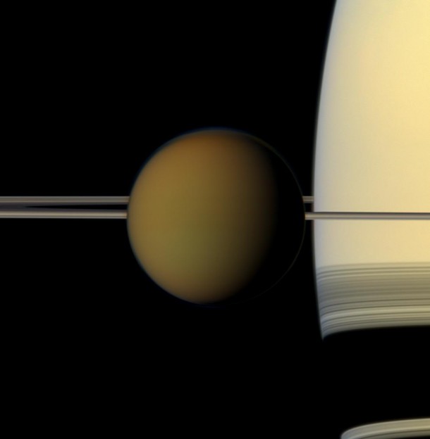 The colorful globe of Saturn's largest moon, Titan, passes in front of the planet and its rings in this true color snapshot from NASA's Cassini spacecraft. Image credit: NASA/JPL-Caltech/Space Science Institute The colorful globe of Saturn's largest moon, Titan, passes in front of the planet and its rings in this true color snapshot from NASA's Cassini spacecraft. Image credit: NASA/JPL-Caltech/Space Science Institute