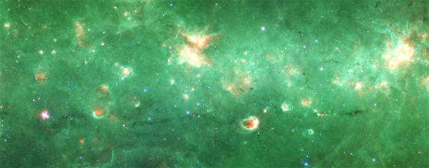 Researchers have identified the first "bone" of the Milky Way - a long tendril of dust and gas that appears dark in this infrared image from the Spitzer Space Telescope. Running horizontally along this image, the "bone" is more than 300 light-years long but only 1 or 2 light-years wide. It contains about 100,000 suns' worth of material. Credit: NASA/JPL/SSC Researchers have identified the first "bone" of the Milky Way - a long tendril of dust and gas that appears dark in this infrared image from the Spitzer Space Telescope. Running horizontally along this image, the "bone" is more than 300 light-years long but only 1 or 2 light-years wide. It contains about 100,000 suns' worth of material. Credit: NASA/JPL/SSC