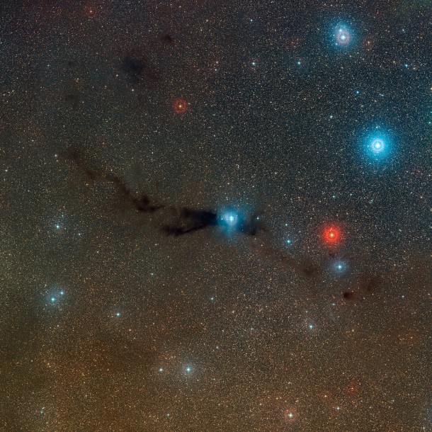 Wide-field view of the Lupus 3 dark cloud and associated hot young stars Credit: ESO/Digitized Sky Survey 2 Acknowledgement: Davide De Martin Wide-field view of the Lupus 3 dark cloud and associated hot young stars Credit: ESO/Digitized Sky Survey 2 Acknowledgement: Davide De Martin