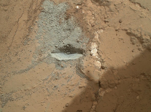 The bit in the rotary-percussion drill of NASA's Mars rover Curiosity left its mark in a target patch of rock called "John Klein" during a test on the rover's 176th Martian day, or sol (Feb. 2, 2013), in preparation for the first drilling of a rock by the rover. Image Credit: NASA/JPL-Caltech/MSSS The bit in the rotary-percussion drill of NASA's Mars rover Curiosity left its mark in a target patch of rock called "John Klein" during a test on the rover's 176th Martian day, or sol (Feb. 2, 2013), in preparation for the first drilling of a rock by the rover. Image Credit: NASA/JPL-Caltech/MSSS
