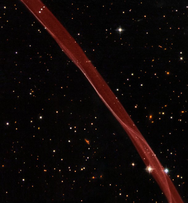 This image is a composite of hydrogen-light observations taken with Hubble's Advanced Camera for Surveys in February 2006 and Wide Field Planetary Camera 2 observations in blue, yellow-green, and near-infrared light taken in April 2008. The supernova remnant, visible only in the hydrogen-light filter was assigned a red hue in this colour image. Credit: NASA, ESA, and the Hubble Heritage Team (STScI/AURA). Acknowledgment: W. Blair (Johns Hopkins University) This image is a composite of hydrogen-light observations taken with Hubble's Advanced Camera for Surveys in February 2006 and Wide Field Planetary Camera 2 observations in blue, yellow-green, and near-infrared light taken in April 2008. The supernova remnant, visible only in the hydrogen-light filter was assigned a red hue in this colour image. Credit: NASA, ESA, and the Hubble Heritage Team (STScI/AURA). Acknowledgment: W. Blair (Johns Hopkins University)