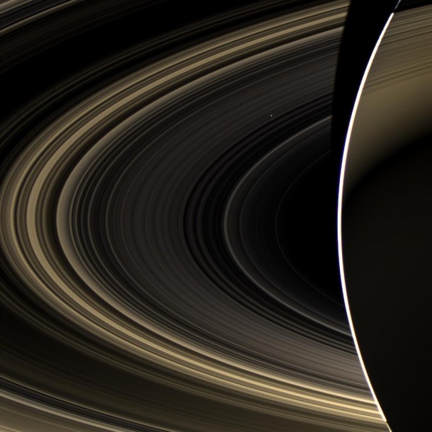 Peering over the shoulder of giant Saturn, through its rings, and across interplanetary space, NASA's Cassini spacecraft spies the bright, cloudy terrestrial planet, Venus. The vast distance from Saturn means that Venus only shows up as a white dot, just above and to the right of the image center. Image credit: NASA/JPL-Caltech/Space Science Institute Peering over the shoulder of giant Saturn, through its rings, and across interplanetary space, NASA's Cassini spacecraft spies the bright, cloudy terrestrial planet, Venus. The vast distance from Saturn means that Venus only shows up as a white dot, just above and to the right of the image center. Image credit: NASA/JPL-Caltech/Space Science Institute