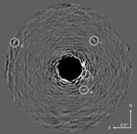 Researchers have conducted a remote reconnaissance of a distant solar system with a new telescope imaging system that sifts through the blinding light of stars. Researchers have conducted a remote reconnaissance of a distant solar system with a new telescope imaging system that sifts through the blinding light of stars.