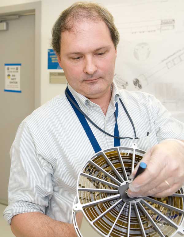 NICER/SEXTANT Principal Investigator Keith Gendreau holds an assembly of X-ray focusing mirrors similar to the type that will fly on his mission in 2017. Credit: Bill Hrybyk NICER/SEXTANT Principal Investigator Keith Gendreau holds an assembly of X-ray focusing mirrors similar to the type that will fly on his mission in 2017. Credit: Bill Hrybyk