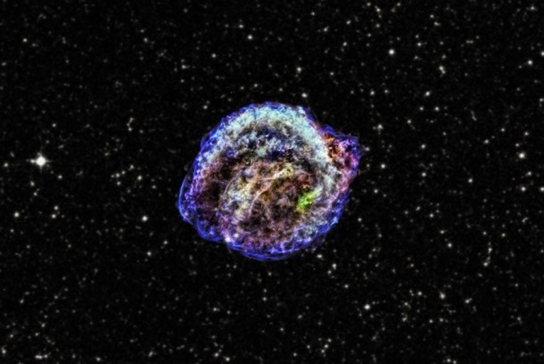 This composite of images from NASA's Chandra X-ray Observatory shows the remnant of Kepler's supernova in low (red), intermediate (green) and high-energy (blue) X-rays. The background is an optical star field taken from the Digitized Sky Survey. The distance to the object is uncertain, with estimates ranging from 13,000 to 23,000 light-years, but recent studies favor the maximum range. This image spans 12 arcminutes or about 80 light-years at the greatest distance. Credit: X-ray: NASA/CXC/NCSU/M.Burkey et al.; optical: DSS This composite of images from NASA's Chandra X-ray Observatory shows the remnant of Kepler's supernova in low (red), intermediate (green) and high-energy (blue) X-rays. The background is an optical star field taken from the Digitized Sky Survey. The distance to the object is uncertain, with estimates ranging from 13,000 to 23,000 light-years, but recent studies favor the maximum range. This image spans 12 arcminutes or about 80 light-years at the greatest distance. Credit: X-ray: NASA/CXC/NCSU/M.Burkey et al.; optical: DSS