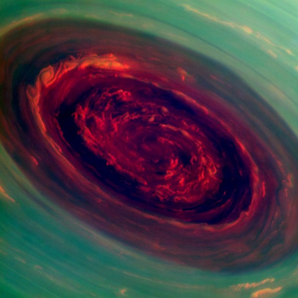 The spinning vortex of Saturn's north polar storm resembles a deep red rose of giant proportions surrounded by green foliage in this false-color image from NASA's Cassini spacecraft. Measurements have sized the eye at a staggering 1,250 miles (2,000 kilometers) across with cloud speeds as fast as 330 miles per hour (150 meters per second). Image Credit: NASA/JPL-Caltech/SSI The spinning vortex of Saturn's north polar storm resembles a deep red rose of giant proportions surrounded by green foliage in this false-color image from NASA's Cassini spacecraft. Measurements have sized the eye at a staggering 1,250 miles (2,000 kilometers) across with cloud speeds as fast as 330 miles per hour (150 meters per second). Image Credit: NASA/JPL-Caltech/SSI