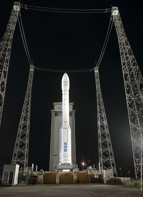 Vega is ready for its second mission from the SLV launch site. The four large towers protect against lightning strikes, while the facility’s mobile gantry has been rolled back to the parked position. Vega is ready for its second mission from the SLV launch site. The four large towers protect against lightning strikes, while the facility’s mobile gantry has been rolled back to the parked position.