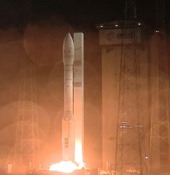 Under a steady rain, Vega’s P80 solid propellant first stage is ignited to begin the light-lift launcher’s 2-hour mission from the Spaceport to deploy the Proba-V, VNREDSat-1 and ESTCube-1 satellite payloads. Under a steady rain, Vega’s P80 solid propellant first stage is ignited to begin the light-lift launcher’s 2-hour mission from the Spaceport to deploy the Proba-V, VNREDSat-1 and ESTCube-1 satellite payloads.