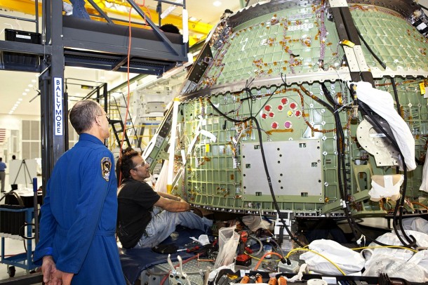 Astronaut Don Pettit watches as a technician works on the Orion crew module inside the Operations and Checkout Building high bay at Kennedy Space Center on March 21. Photo credit: NASA/Dimitri Gerondidakis Astronaut Don Pettit watches as a technician works on the Orion crew module inside the Operations and Checkout Building high bay at Kennedy Space Center on March 21. Photo credit: NASA/Dimitri Gerondidakis