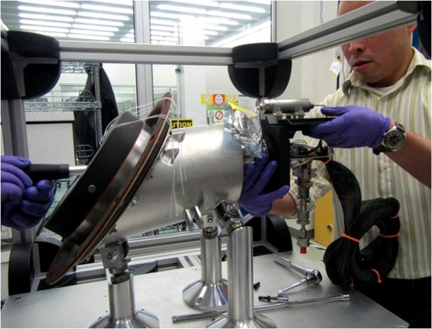 A technician works on a reaction control system pod at the Aerojet facility in Redmond, Wash. The pod is one of eight that will be installed on the Orion crew module for Exploration Flight Test-1 and provide the critical maneuvers necessary for re-entry into the Earth’s atmosphere.” Photo courtesy of Aerojet A technician works on a reaction control system pod at the Aerojet facility in Redmond, Wash. The pod is one of eight that will be installed on the Orion crew module for Exploration Flight Test-1 and provide the critical maneuvers necessary for re-entry into the Earth’s atmosphere.” Photo courtesy of Aerojet