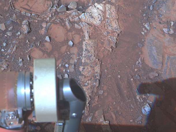 The pale rock in the upper center of this image, about the size of a human forearm, includes a target called "Esperance," which was inspected by NASA's Mars Exploration Rover Opportunity. Data from the rover's alpha particle X-ray spectrometer (APXS) indicate that Esperance's composition is higher in aluminum and silica, and lower in calcium and iron, than other rocks Opportunity has examined in more than nine years on Mars. Preliminary interpretation points to clay mineral content due to intensive alteration by water. Image Credit: NASA/JPL-Caltech/Cornell/Arizona State Univ. The pale rock in the upper center of this image, about the size of a human forearm, includes a target called "Esperance," which was inspected by NASA's Mars Exploration Rover Opportunity. Data from the rover's alpha particle X-ray spectrometer (APXS) indicate that Esperance's composition is higher in aluminum and silica, and lower in calcium and iron, than other rocks Opportunity has examined in more than nine years on Mars. Preliminary interpretation points to clay mineral content due to intensive alteration by water. Image Credit: NASA/JPL-Caltech/Cornell/Arizona State Univ.