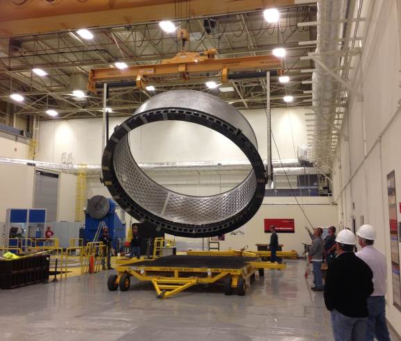 The structural test article adapter is flipped at Marshall testing facility Building 4705. The turnover is an important step in finishing the machining work on the adapter, which will undergo tests to certify subsequent flight units used to attach the Orion spacecraft to a Delta IV rocket for its 2014 Exploration Flight Test-1. (NASA/MSFC) The structural test article adapter is flipped at Marshall testing facility Building 4705. The turnover is an important step in finishing the machining work on the adapter, which will undergo tests to certify subsequent flight units used to attach the Orion spacecraft to a Delta IV rocket for its 2014 Exploration Flight Test-1. (NASA/MSFC)