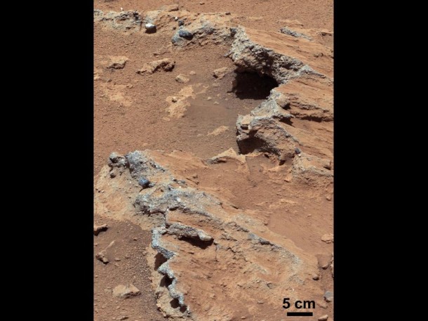 NASA's Curiosity rover found evidence for an ancient, flowing stream on Mars at a few sites, including the rock outcrop pictured here, which the science team has named "Hottah" after Hottah Lake in Canada's Northwest Territories. It may look like a broken sidewalk, but this geological feature on Mars is actually exposed bedrock made up of smaller fragments cemented together, or what geologists call a sedimentary conglomerate. Scientists theorize that the bedrock was disrupted in the past, giving it the titled angle, most likely via impacts from meteorites. Image credit: NASA/JPL-Caltech/MSSS NASA's Curiosity rover found evidence for an ancient, flowing stream on Mars at a few sites, including the rock outcrop pictured here, which the science team has named "Hottah" after Hottah Lake in Canada's Northwest Territories. It may look like a broken sidewalk, but this geological feature on Mars is actually exposed bedrock made up of smaller fragments cemented together, or what geologists call a sedimentary conglomerate. Scientists theorize that the bedrock was disrupted in the past, giving it the titled angle, most likely via impacts from meteorites. Image credit: NASA/JPL-Caltech/MSSS