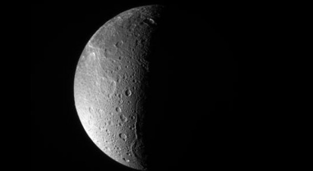 The Cassini spacecraft looks down, almost directly at the north pole of Dione. The feature just left of the terminator at bottom is Janiculum Dorsa, a long, roughly north-south trending ridge. Image credit: NASA/JPL/Space Science Institute The Cassini spacecraft looks down, almost directly at the north pole of Dione. The feature just left of the terminator at bottom is Janiculum Dorsa, a long, roughly north-south trending ridge. Image credit: NASA/JPL/Space Science Institute