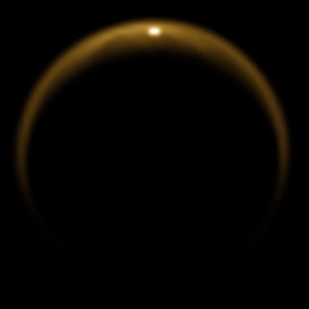 This image shows the first flash of sunlight reflected off a hydrocarbon lake on Saturn's moon Titan. The glint off a mirror-like surface is known as a specular reflection. This kind of glint was detected by the visual and infrared mapping spectrometer (VIMS) on NASA's Cassini spacecraft on July 8, 2009. It confirmed the presence of liquid in the moon's northern hemisphere, where lakes are more numerous and larger than those in the southern hemisphere. Scientists using VIMS had confirmed the presence of liquid in Ontario Lacus, the largest lake in the southern hemisphere, in 2008. Image credit: NASA/JPL/University of Arizona/DLR This image shows the first flash of sunlight reflected off a hydrocarbon lake on Saturn's moon Titan. The glint off a mirror-like surface is known as a specular reflection. This kind of glint was detected by the visual and infrared mapping spectrometer (VIMS) on NASA's Cassini spacecraft on July 8, 2009. It confirmed the presence of liquid in the moon's northern hemisphere, where lakes are more numerous and larger than those in the southern hemisphere. Scientists using VIMS had confirmed the presence of liquid in Ontario Lacus, the largest lake in the southern hemisphere, in 2008. Image credit: NASA/JPL/University of Arizona/DLR