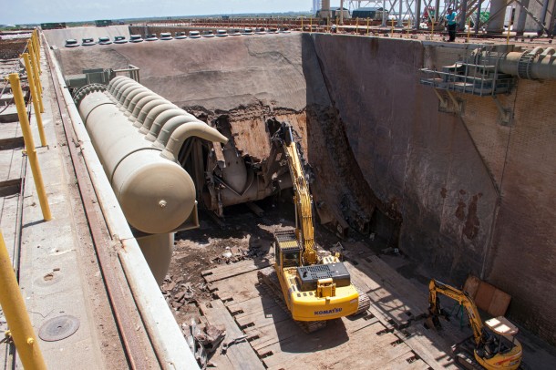 At Launch Pad 39B at NASA’s Kennedy Space Center in Florida, construction workers continue to remove the flame trench deflector that sits below and between the left and right crawlerway tracks. Photo credit: NASA/Jim Grossman At Launch Pad 39B at NASA’s Kennedy Space Center in Florida, construction workers continue to remove the flame trench deflector that sits below and between the left and right crawlerway tracks. Photo credit: NASA/Jim Grossman