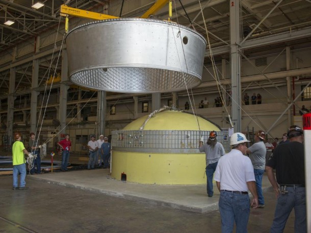 An adapter is lowered onto a ULA Delta IV test article for a fit check June 26 at the Marshall Center. (NASA/MSFC/Fred Deaton) An adapter is lowered onto a ULA Delta IV test article for a fit check June 26 at the Marshall Center. (NASA/MSFC/Fred Deaton)