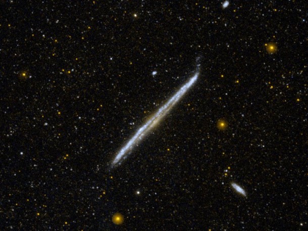 This image from NASA's Galaxy Evolution Explorer shows NGC 4565, one of the nearest and brightest galaxies not included in the famous list by 18th-century comet hunter Charles Messier. Image credit: NASA/JPL-Caltech This image from NASA's Galaxy Evolution Explorer shows NGC 4565, one of the nearest and brightest galaxies not included in the famous list by 18th-century comet hunter Charles Messier. Image credit: NASA/JPL-Caltech
