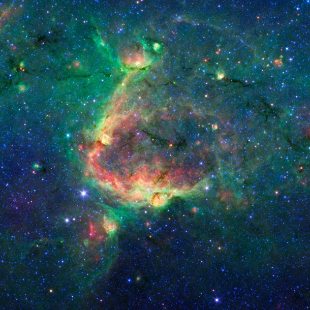 This infrared image shows a striking example of what is called a hierarchical bubble structure, in which one giant bubble, carved into the dust of space by massive stars, has triggered the formation of smaller bubbles. Image credit: NASA/JPL-Caltech/University of Wisconsin This infrared image shows a striking example of what is called a hierarchical bubble structure, in which one giant bubble, carved into the dust of space by massive stars, has triggered the formation of smaller bubbles. Image credit: NASA/JPL-Caltech/University of Wisconsin