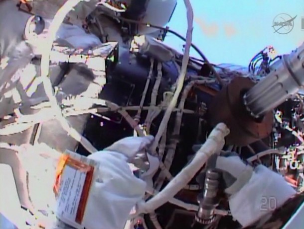 Flight Engineer Chris Cassidy routes cables outside the International Space Station during an Expedition 36 spacewalk. Image Credit: NASA TV Flight Engineer Chris Cassidy routes cables outside the International Space Station during an Expedition 36 spacewalk. Image Credit: NASA TV
